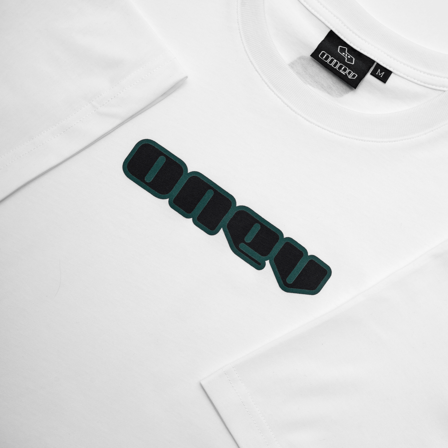 ONEV Vital Tee | White w/ green & black lettering